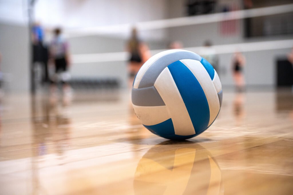 Volleyball sitting in corner of court